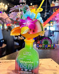 Mi Cozumel signature dishes MolcajetePineapple FajitasOversized Cocktails﻿﻿﻿